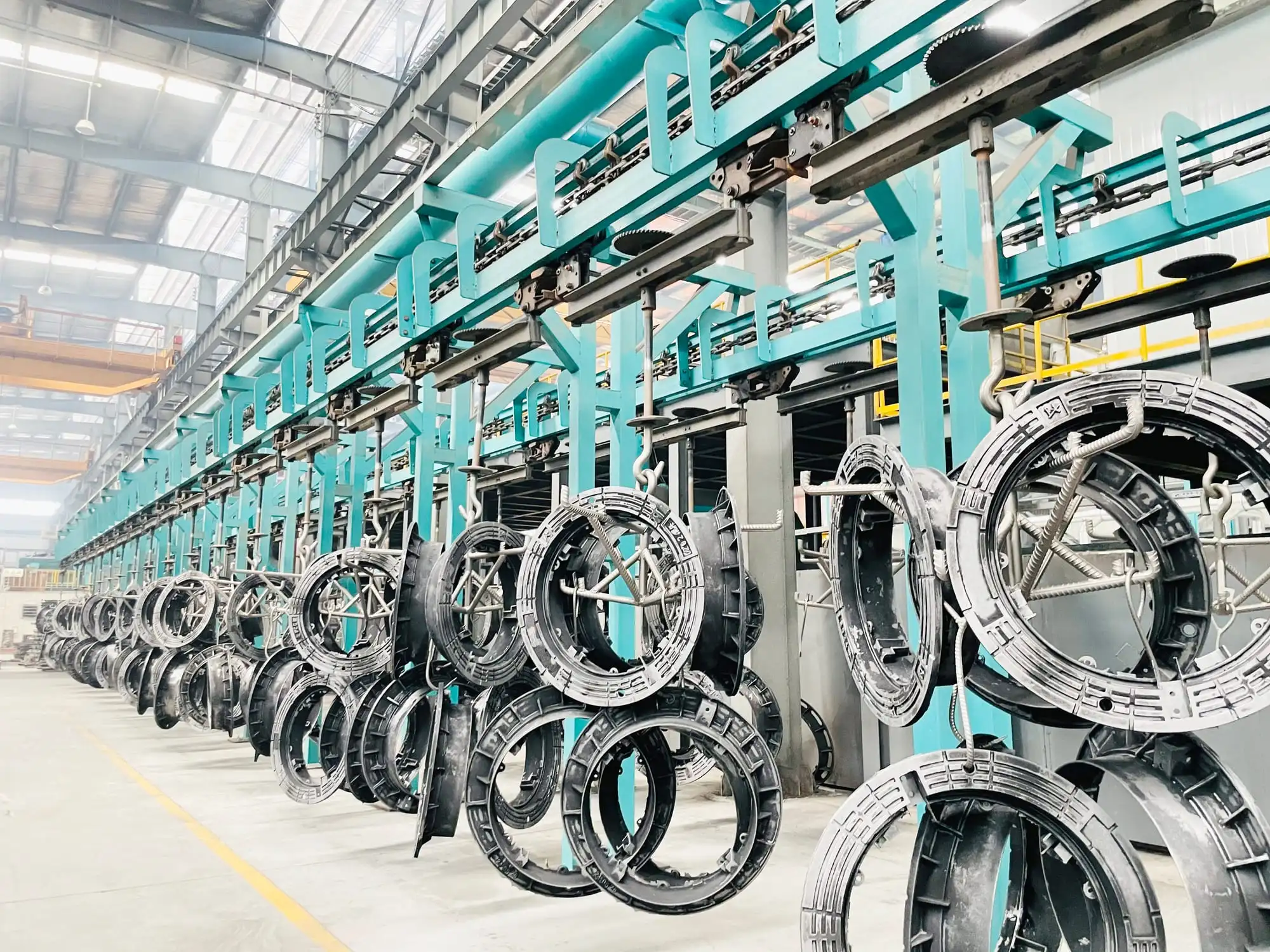 Ductile iron manhole covers on the LZB shot-blasting production line